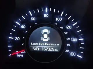 2015 Kia Optima LX with VIN 5XXGM4A74FG483165, listed as a IAAI auction lot 41117924 with 167,329 mi miles. Bid and sale history available at carsss.com. Image 7.