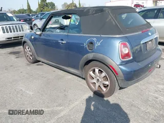 2010 MINI Convertible with VIN WMWMR3C53ATU97865, listed as a IAAI auction lot 41610670 with 154,457 mi miles and . Bid and sale history available at DreamBid. Image 3.