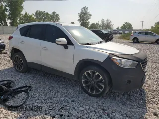 2016 Mazda CX-5 Grand Touring z VIN JM3KE4DY7G0864109, wystawiony jako Copart lot #59635865 z przebiegiem Nie podano mil oraz Czysty tytuł • Clean title. Historia ofert i sprzedaży dostępna na DreamBid. Obrazek 4.