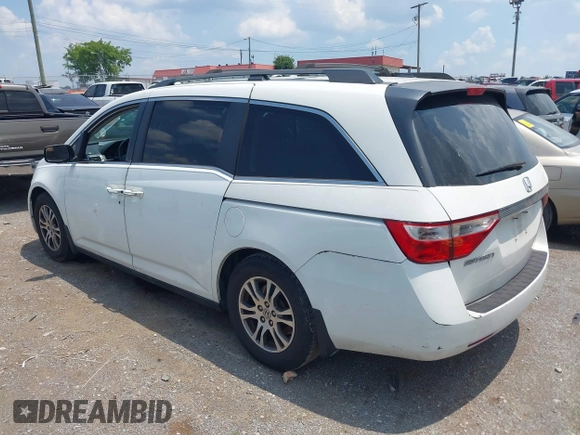 2012 Honda Odyssey EX-L with VIN 5FNRL5H63CB063684, listed as a IAAI auction lot 42576742 with 170,656 mi miles and . Bid and sale history available at DreamBid. Image 3.
