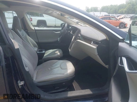 2013 Tesla Model S Performance z VIN 5YJSA1CP1DFP21827, wystawiony jako IAAI lot #42494897 z przebiegiem 148 150 mil mil oraz . Historia ofert i sprzedaży dostępna na DreamBid. Obrazek 5.