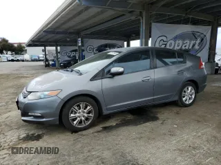 2011 Honda Insight EX with VIN JHMZE2H77BS006079, listed as a Copart auction lot 63873985 with 134,159 mi miles and Salvage title. Bid and sale history available at DreamBid. Image 1.