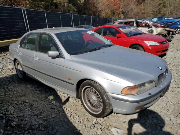 2000 BMW 5 Series 528iA with VIN WBADM6344YGU10582, listed as a Copart auction lot 77468634 with 0 mi miles and Salvage Title. Bid and sale history available at carsss.com. Image 4.