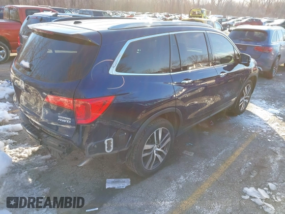 2017 Honda Pilot Touring with VIN 5FNYF6H99HB105446, listed as a IAAI auction lot 41283368 with 91,452 mi miles and . Bid and sale history available at DreamBid. Image 4.