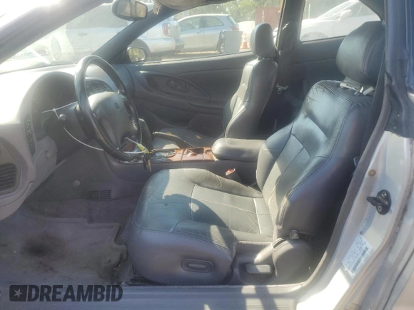 1997 Chrysler Sebring LXi z VIN 4C3AU52NXVE180034, wystawiony jako Copart lot #73413994 z przebiegiem 123 637 mil mil oraz Tytuł czysty. Historia ofert i sprzedaży dostępna na DreamBid. Obrazek 7.
