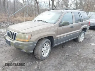 2001 Jeep Grand Cherokee Laredo with VIN 1J4GW48SX1C658610, listed as a IAAI auction lot 41831013 with 200,142 mi miles and . Bid and sale history available at DreamBid. Image 2.