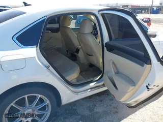 2014 Volkswagen Passat TDI SE w/Sunroof with VIN 1VWBN7A32EC016554, listed as a IAAI auction lot 41472156 with 178,149 mi miles. Bid and sale history available at carsss.com. Image 8.