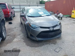 2018 Toyota Corolla L z VIN 5YFBURHE1JP855556, wystawiony jako IAAI lot #42273685 z przebiegiem 165 792 mil mil oraz . Historia ofert i sprzedaży dostępna na DreamBid. Obrazek 1.