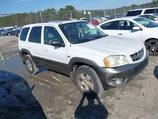 2004 Mazda Tribute ES with VIN 4F2CZ06164KM12579, listed as a IAAI auction lot 41654646 with 208,120 mi miles. Bid and sale history available at carsss.com. Image 1.