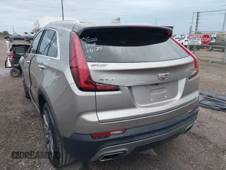 2022 Cadillac XT4 FWD Premium Luxury with VIN 1GYFZCR45NF164754, listed as a IAAI auction lot 41278705 with 65,698 mi miles. Bid and sale history available at carsss.com. Image 3.