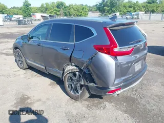 2018 Honda CR-V Touring z VIN 5J6RW2H93JL004834, wystawiony jako IAAI lot #42351364 z przebiegiem 63 746 mil mil oraz . Historia ofert i sprzedaży dostępna na DreamBid. Obrazek 3.