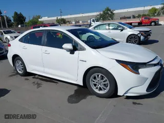 2021 Toyota Corolla Hybrid LE with VIN JTDEAMDE6MJ032371, listed as a IAAI auction lot 42086942 with 68,335 mi miles. Bid and sale history available at carsss.com. Image 1.