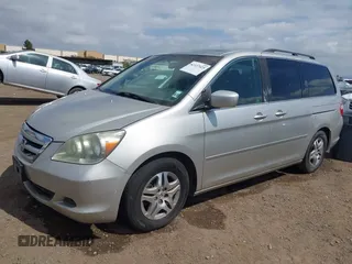 2005 Honda Odyssey EX-L with VIN 5FNRL38655B002926, listed as a IAAI auction lot 42137025 with 209,863 mi miles. Bid and sale history available at carsss.com. Image 2.