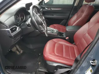 2024 Mazda CX-5 S Carbon Edition z VIN JM3KFBCM6R0367121, wystawiony jako Copart lot #51570125 z przebiegiem 49 762 mil mil oraz Szkody całkowita. Historia ofert i sprzedaży dostępna na DreamBid. Obrazek 7.