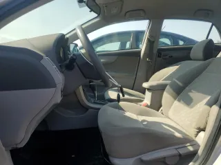 2010 Toyota Corolla with VIN 2T1BU4EE3AC451732, listed as a Copart auction lot 61866625 with 215,714 mi miles and Clean title. Bid and sale history available at DreamBid. Image 7.