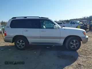 2005 Toyota Land Cruiser z VIN JTEHT05J952078683, wystawiony jako IAAI lot #41769150 z przebiegiem 299 737 mil mil oraz . Historia ofert i sprzedaży dostępna na DreamBid. Obrazek 13.