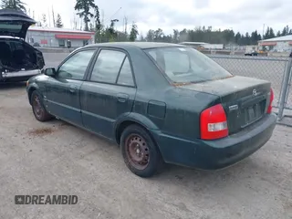 1999 Mazda Protege DX z VIN JM1BJ2222X0151674, wystawiony jako IAAI lot #42444584 z przebiegiem 219 862 mil mil oraz . Historia ofert i sprzedaży dostępna na DreamBid. Obrazek 3.