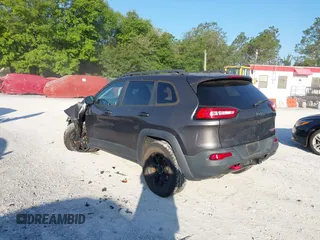 2018 Jeep Cherokee Trailhawk with VIN 1C4PJMBX7JD517299, listed as a IAAI auction lot 42022770 with 62,865 mi miles. Bid and sale history available at carsss.com. Image 3.