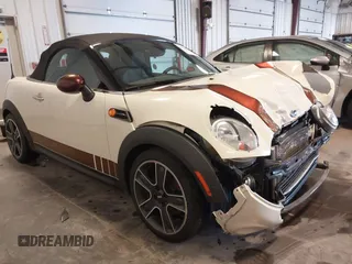 2013 MINI Roadster with VIN WMWSY1C52DT625564, listed as a IAAI auction lot 41442864 with 98,240 mi miles and . Bid and sale history available at DreamBid. Image 1.