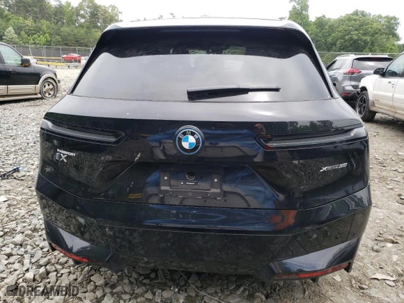 2024 BMW iX xDrive50 with VIN WB523CF09RCP70617, listed as a Copart auction lot 58091014 with 2,539 mi miles and Salvage Title. Bid and sale history available at carsss.com. Image 6.