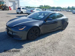 2022 Tesla Model S with VIN 5YJSA1E57NF479056, listed as a IAAI auction lot 42091009 with 78,272 mi miles and . Bid and sale history available at DreamBid. Image 2.