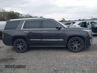 2016 Cadillac Escalade Platinum z VIN 1GYS4DKJ1GR363238, wystawiony jako IAAI lot #40974636 z przebiegiem 128 296 mil mil oraz . Historia ofert i sprzedaży dostępna na DreamBid. Obrazek 13.