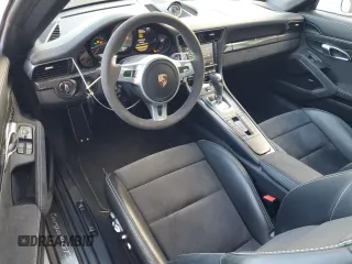2016 Porsche 911 4S with VIN WP0BB2A93GS136097, listed as a Copart auction lot 76078574 with 14,208 mi miles and Salvage Title. Bid and sale history available at DreamBid. Image 8.