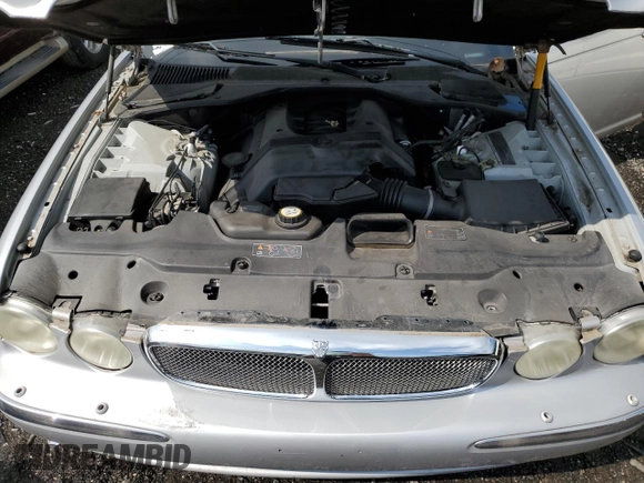 2006 Jaguar XJ Vanden Plas z VIN SAJWA82B46SG49807, wystawiony jako Copart lot #58930685 z przebiegiem 116 710 mil mil oraz Szkoda całkowita • Salvage title. Historia ofert i sprzedaży dostępna na DreamBid. Obrazek 11.