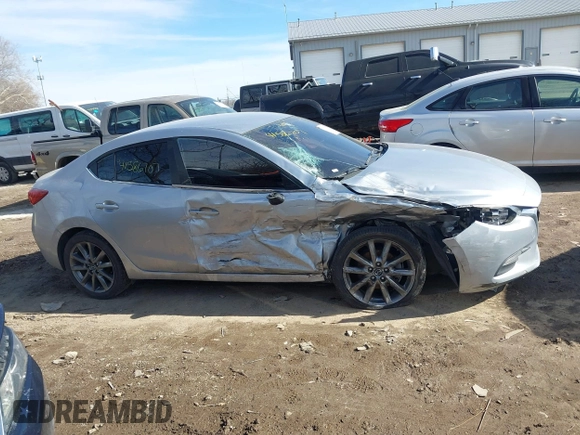 2018 Mazda 3 Touring z VIN 3MZBN1V36JM205904, wystawiony jako IAAI lot #41586707 z przebiegiem 145 401 mil mil oraz . Historia ofert i sprzedaży dostępna na DreamBid. Obrazek 12.