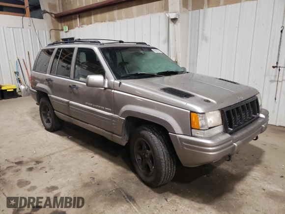 1998 Jeep Grand Cherokee Limited with VIN 1J4GZ88Z1WC289820, listed as a Copart auction lot 88583995 with 245,572 mi miles and Clean Title. Bid and sale history available at carsss.com. Image 4.