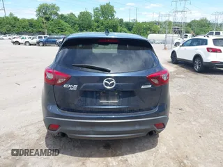 2016 Mazda CX-5 Grand Touring z VIN JM3KE4DY1G0817562, wystawiony jako IAAI lot #42289929 z przebiegiem 135 476 mil mil oraz . Historia ofert i sprzedaży dostępna na DreamBid. Obrazek 16.