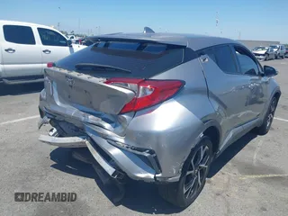 2018 Toyota C-HR XLE z VIN NMTKHMBX2JR057798, wystawiony jako IAAI lot #42327724 z przebiegiem 115 715 mil mil oraz . Historia ofert i sprzedaży dostępna na DreamBid. Obrazek 4.