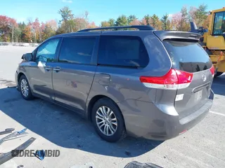 2014 Toyota Sienna XLE with VIN 5TDYK3DC1ES472036, listed as a IAAI auction lot 40546573 with 134,907 mi miles and . Bid and sale history available at DreamBid. Image 3.