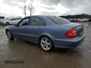 2004 Mercedes-Benz E-Class 5.0L with VIN WDBUF70J94A406133, listed as a Copart auction lot 44396845 with 123,999 mi miles and Salvage Title. Bid and sale history available at carsss.com. Image 2.