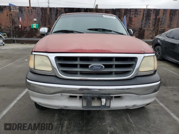 2001 Ford F-150 XLT with VIN 1FTRW07WX1KE51166, listed as a Copart auction lot 60164025 with 157,035 mi miles and Salvage title. Bid and sale history available at DreamBid. Image 5.