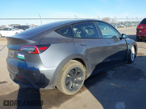 2023 Tesla Model Y Long Range with VIN 7SAYGAEEXPF714760, listed as a IAAI auction lot 41748398 with 49,802 mi miles and . Bid and sale history available at DreamBid. Image 4.