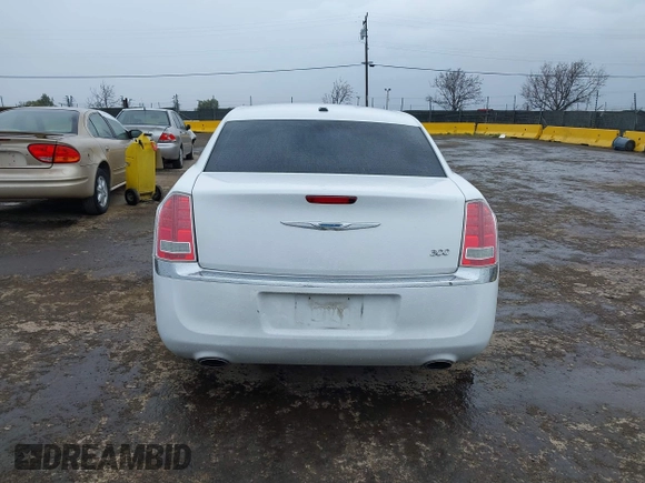 2014 Chrysler 300 with VIN 2C3CCAAG2EH235495, listed as a IAAI auction lot 41787801 with 142,354 mi miles and . Bid and sale history available at DreamBid. Image 16.