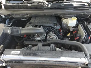 2019 Ram 1500 Big Horn z VIN 1C6RREBT7KN568289, wystawiony jako Copart lot #57787245 z przebiegiem 131 599 mil mil oraz Szkoda całkowita • Salvage title. Historia ofert i sprzedaży dostępna na DreamBid. Obrazek 11.