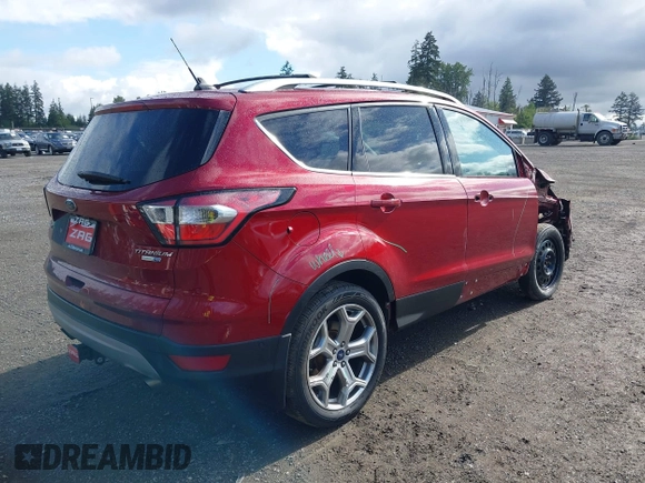 2018 Ford Escape Titanium with VIN 1FMCU9J99JUB44963, listed as a IAAI auction lot 42293113 with 68,803 mi miles and . Bid and sale history available at DreamBid. Image 4.