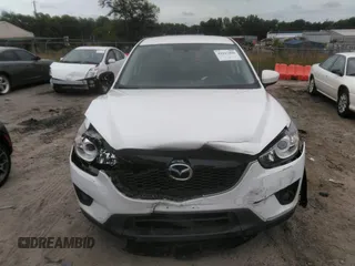 2014 Mazda CX-5 Touring z VIN JM3KE4CY0E0303748, wystawiony jako IAAI lot #42127406 z przebiegiem Nie podano mil oraz . Historia ofert i sprzedaży dostępna na DreamBid. Obrazek 11.
