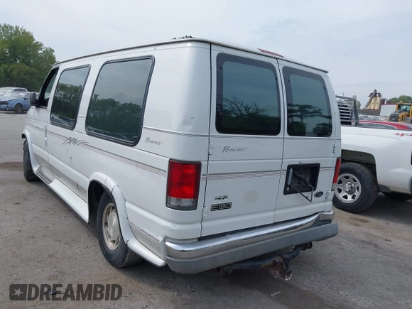 1999 Ford Econoline Cargo with VIN 1FDRE14WXXHB72976, listed as a IAAI auction lot 37688871 with 135,319 mi miles. Bid and sale history available at carsss.com. Image 3.