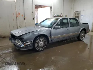 1991 Cadillac Seville z VIN 1G6KS53B2MU809384, wystawiony jako Copart lot #77185134 z przebiegiem 134 769 mil mil oraz Szkody całkowita. Historia ofert i sprzedaży dostępna na DreamBid. Obrazek 1.