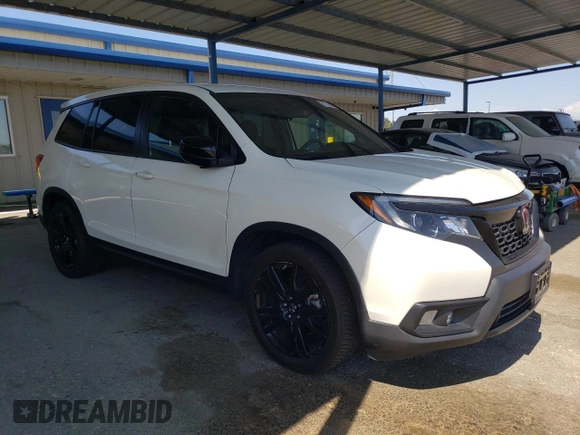 2019 Honda Passport Sport with VIN 5FNYF7H23KB005357, listed as a Copart auction lot 62219045 with 52,384 mi miles and Salvage title. Bid and sale history available at DreamBid. Image 4.