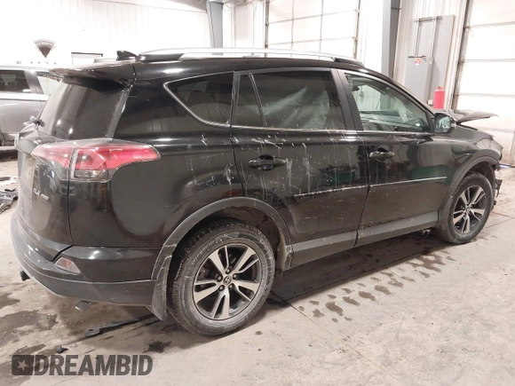 2018 Toyota RAV4 XLE with VIN 2T3RFREV3JW817989, listed as a IAAI auction lot 41636957 with 182,265 mi miles. Bid and sale history available at carsss.com. Image 4.
