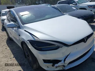2023 Tesla Model X with VIN 7SAXCDE50PF414198, listed as a IAAI auction lot 41880957 with Not Provided miles and . Bid and sale history available at DreamBid. Image 1.