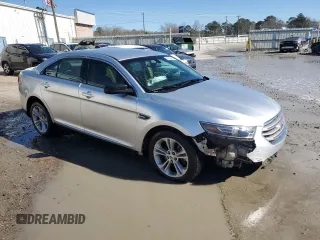 2015 Ford Taurus SE with VIN 1FAHP2D84FG149799, listed as a Copart auction lot 88993345 with 114,131 mi miles and Salvage Title. Bid and sale history available at DreamBid. Image 4.