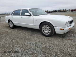 1999 Jaguar XJ with VIN SAJHX1040XC864208, listed as a Copart auction lot 59748585 with 130,577 mi miles and Clean title. Bid and sale history available at DreamBid. Image 4.