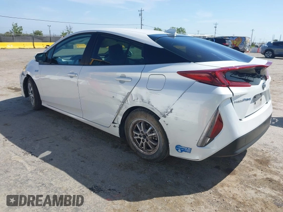 2021 Toyota Prius LE with VIN JTDKAMFP2M3177459, listed as a IAAI auction lot 42093828 with 65,501 mi miles and . Bid and sale history available at DreamBid. Image 3.