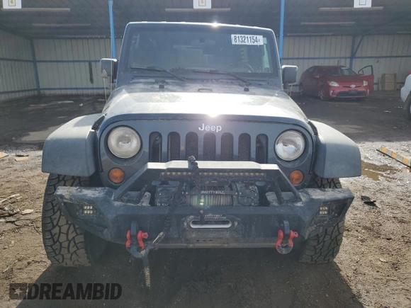 2007 Jeep Wrangler Unlimited Rubicon with VIN 1J4GA69177L100903, listed as a Copart auction lot 81321154 with 130,632 mi miles and Salvage title. Bid and sale history available at DreamBid. Image 5.
