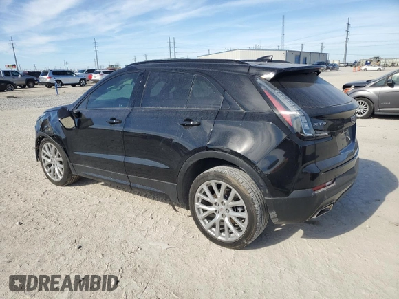 2023 Cadillac XT4 FWD Sport with VIN 1GYFZER47PF107311, listed as a Copart auction lot 87583565 with 26,585 mi miles and Salvage title. Bid and sale history available at DreamBid. Image 2.